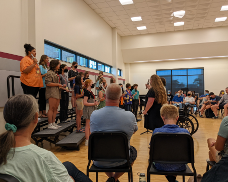 choir singers on risers with conductor